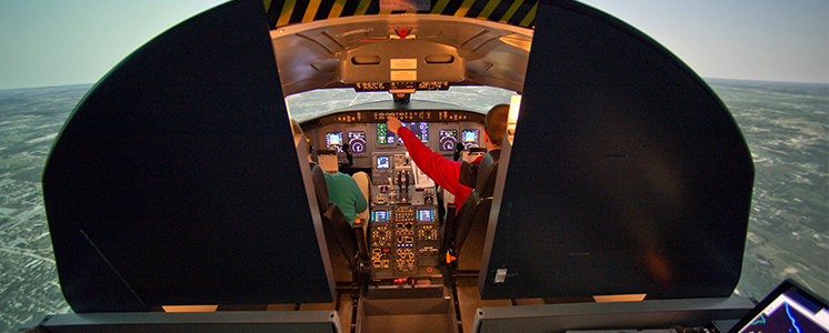 Students in flight training simulation